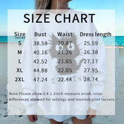 Size chart for Kitten Graphic Sweatshirt with bust, waist, and dress length measurements on a white sweatshirt featuring a playful black kitten graphic, worn by a person on a beach background