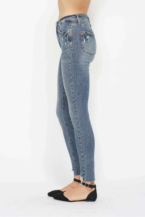 Tummy Control Vintage Skinny Jeans with high-rise waistband and distressed hem in classic wash.
