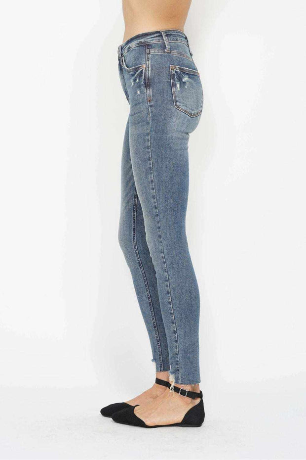 Tummy Control Vintage Skinny Jeans with high-rise waistband and distressed hem in classic wash.