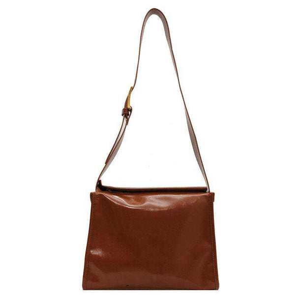 Retro Crossbody Commuter Tote in brown with adjustable strap, PU material, designed for practicality and style.