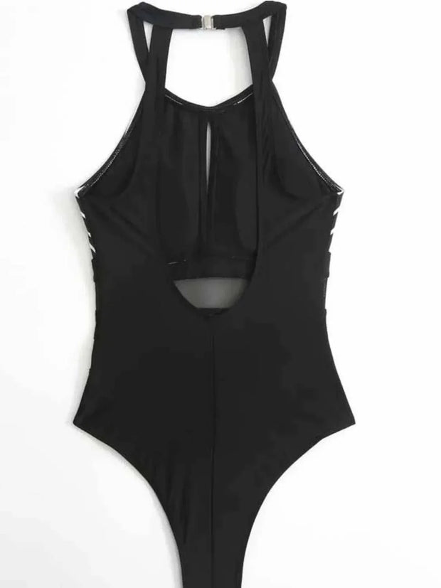 Black mesh backless swimsuit with cutout details and moderate stretch fabric