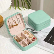 Compact green Jewelry Zipper Box Storage with multiple compartments for organizing necklaces, earrings, and rings.