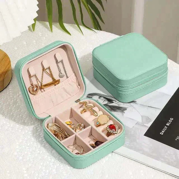 Compact green Jewelry Zipper Box Storage with multiple compartments for organizing necklaces, earrings, and rings.