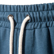 Elastic waistband of Tether Shorts for Men in blue fabric with white drawstring.