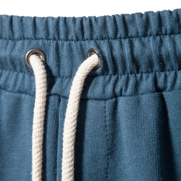 Elastic waistband of Tether Shorts for Men in blue fabric with white drawstring.