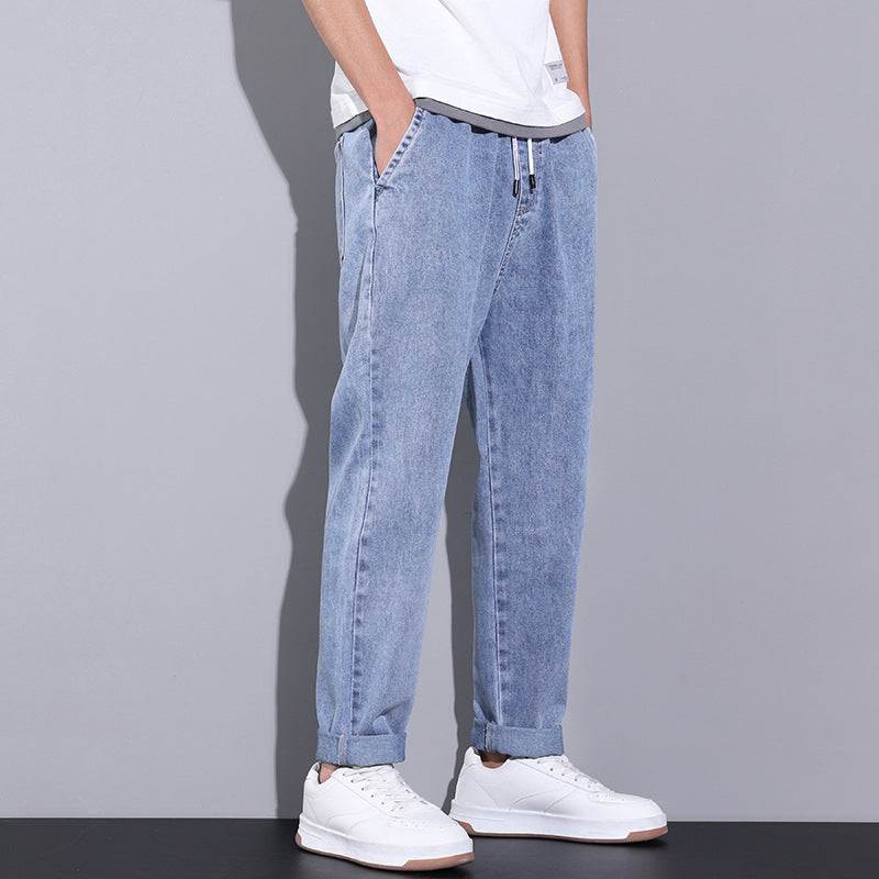 Men's drawstring wide leg straight jeans in breathable denim with adjustable waistband and relaxed fit from Hot Topic Goods