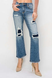 RISEN Distressed Flare Jeans with edgy distressed details and a flattering flare design.
