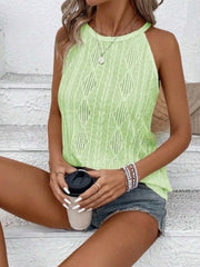 Textured round neck tank in light green, featuring intricate fabric patterns, paired with denim shorts.