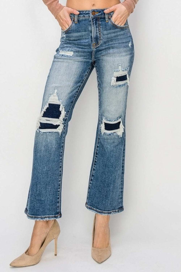 RISEN Distressed Flare Jeans with edgy distressed details and high-rise waist.