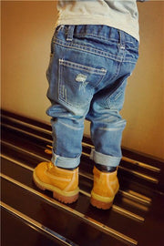 European Style Boys Ripped Jeans with trendy distressed details.