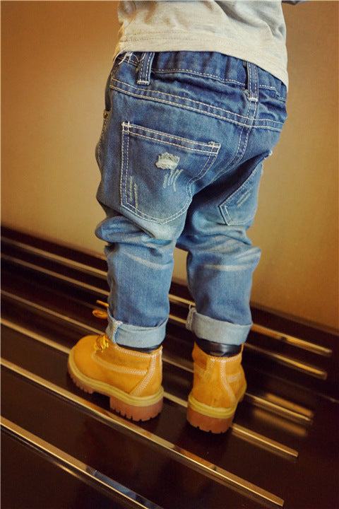 European Style Boys Ripped Jeans with trendy distressed details.