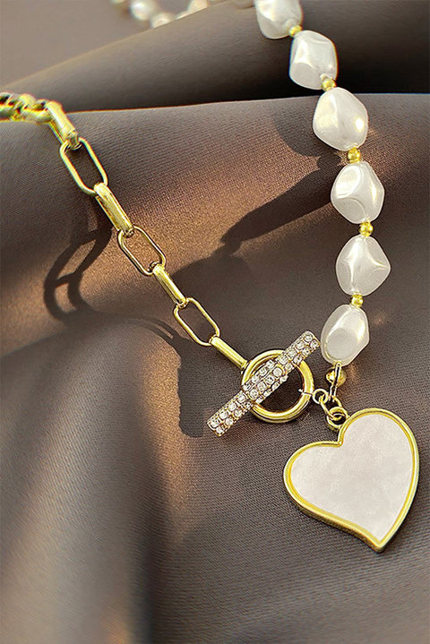 Gold Heart Rhinestone Pearl Necklace with heart-shaped pendant, rhinestones, and pearl accents.