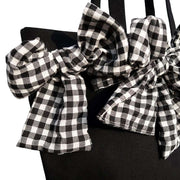 Big Bow Crossbody Bag with checkered oversized bow detail and black base.