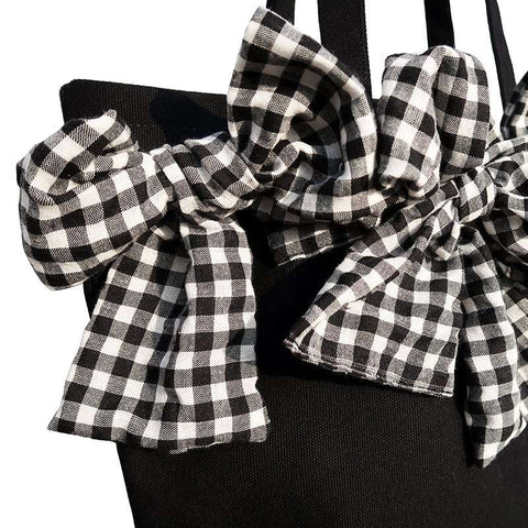 Big Bow Crossbody Bag with checkered oversized bow detail and black base.