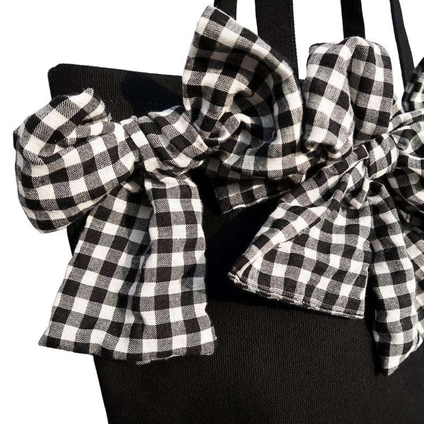 Big Bow Crossbody Bag with checkered oversized bow detail and black base.