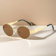 Metal Oval Vintage Sunglasses with gold frames and brown lenses on beige background.