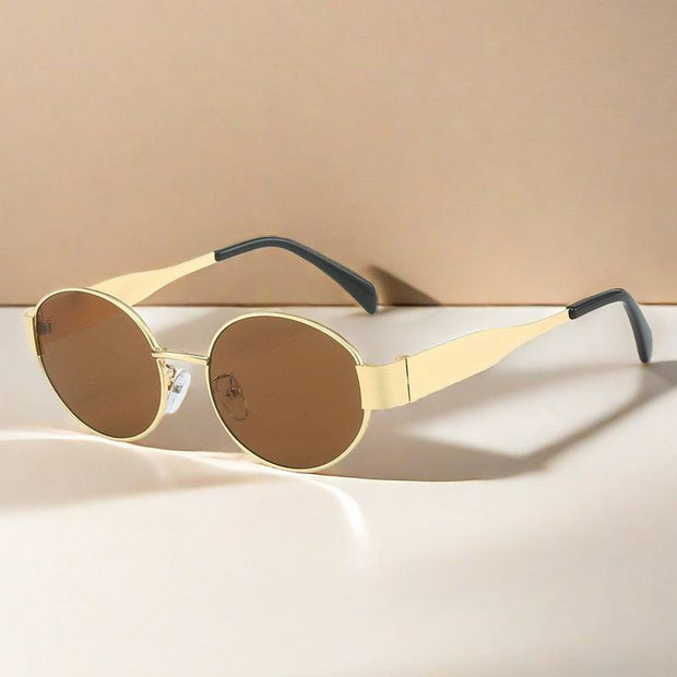 Metal Oval Vintage Sunglasses with gold frames and brown lenses on beige background.
