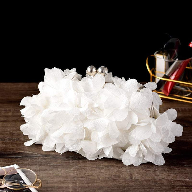 Exquisite white bridal clutch with floral design, perfect wedding accessory.