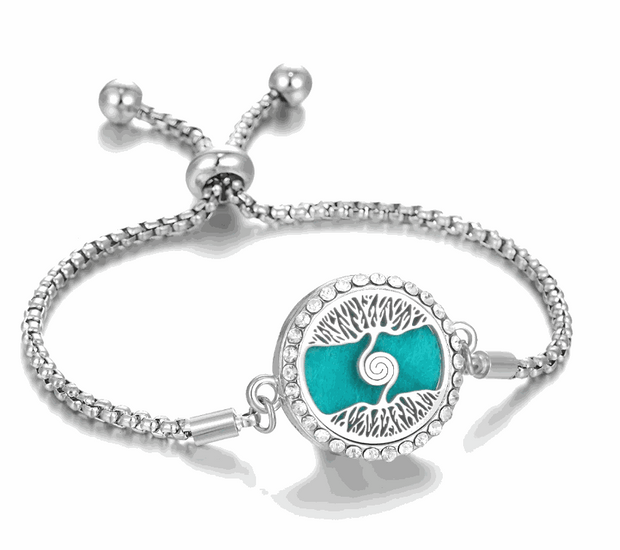Hollow Stainless Steel Aromatherapy Bracelet with intricate design and adjustable band.