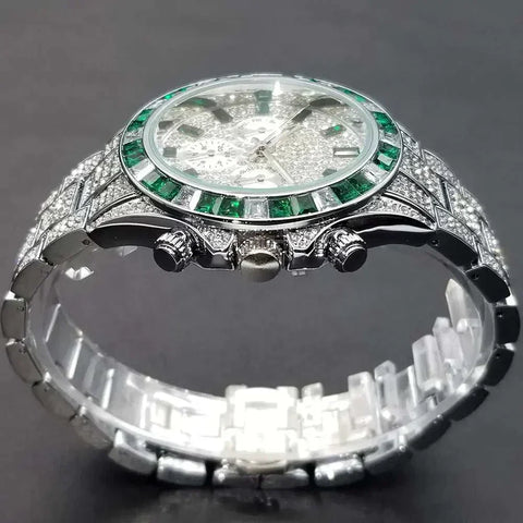 Luxurious Diamond Calendar Watch with emerald accents and a sleek silver band.