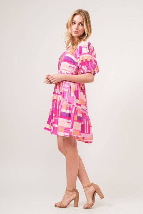 Color Block Puff Sleeve Dress with bold geometric pattern and puff sleeves, styled with neutral heels.