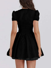 V-Neck short sleeve mini dress in black, stylish and versatile for any occasion.