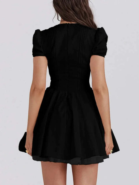 V-Neck short sleeve mini dress in black, stylish and versatile for any occasion.