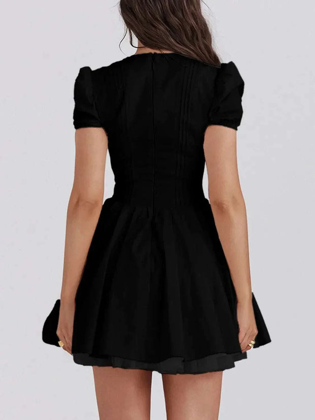 V-Neck short sleeve mini dress in black, stylish and versatile for any occasion.