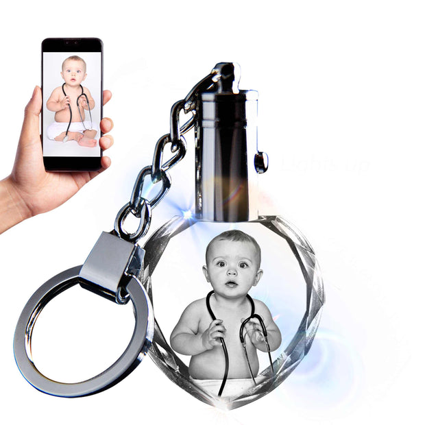Custom crystal keychain with baby photo and smartphone.