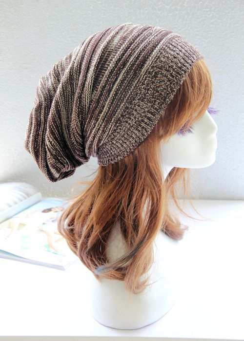 Pleated Pullover Hat in brown and white on mannequin bust.