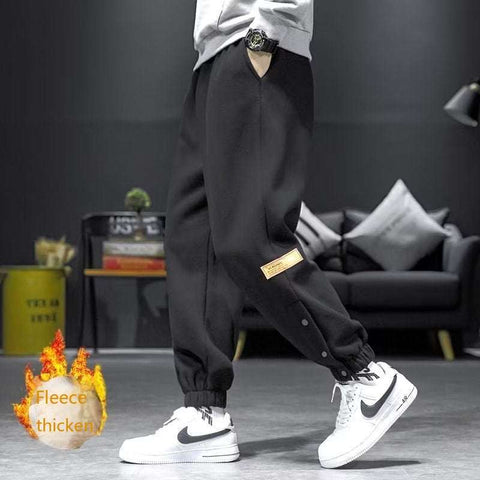 Casual velvet padded pants in black, styled with elastic waistband, showcasing fleece thickness for warmth and comfort.