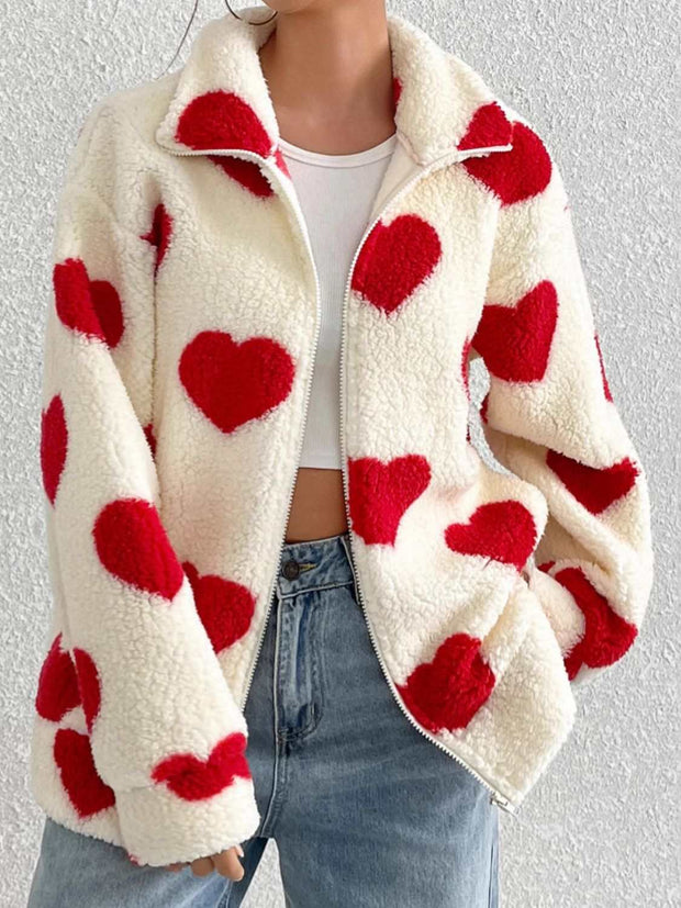 Heart Furry Zip-Up Jacket with red heart motifs, plush texture, worn with jeans.