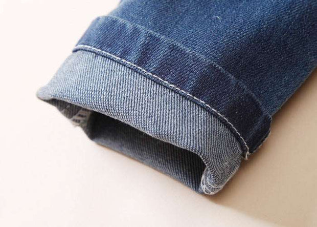 European Style Boys Ripped Jeans with rolled cuff detail.