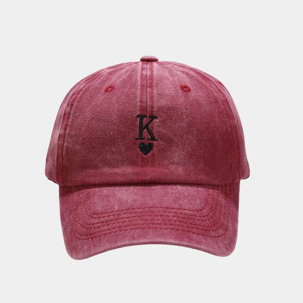 Vintage baseball cap in wine red with embroidered design.