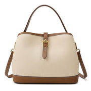 Milky white ladies messenger bag with leather accents and adjustable shoulder strap.