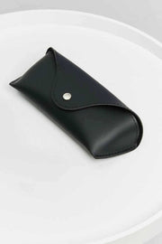 Black case for Metal Plastic Hybrid Full Rim Sunglasses on white surface.