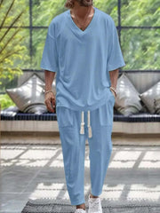 Men's V-neck half sleeve top and pants set in light blue, featuring a relaxed fit and casual style.