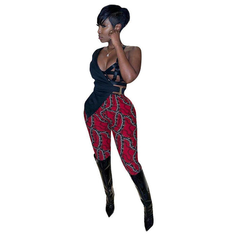 Casual Silk Print Leggings in red with a unique pattern, paired with a black top and boots.