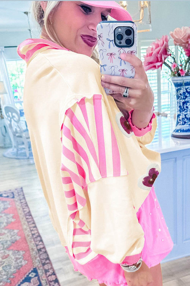Pink Sequin Heart Collared Top with a playful design and vibrant pink color, featuring a unique sequin heart embellishment.