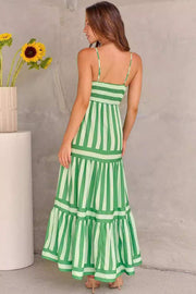 Green striped smocked dress with tiered design and spaghetti straps.