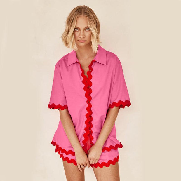 Stylish 2 Piece Summer Suit in pink with red trim, ideal for warm weather occasions.