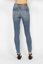 Tummy Control Vintage Skinny Jeans with high-rise waist and distressed details.