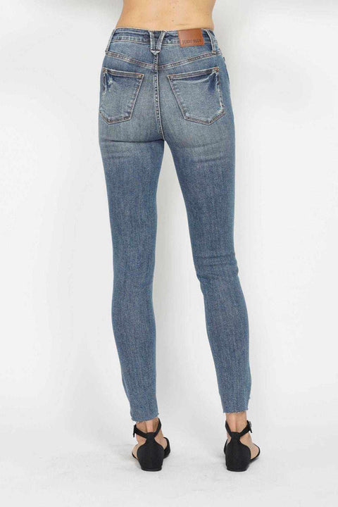 Tummy Control Vintage Skinny Jeans with high-rise waist and distressed details.