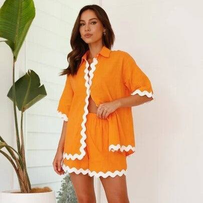 2 Piece Summer Suit in vibrant orange with white trim, ideal for casual and formal summer occasions.