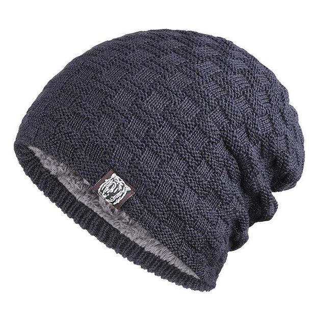 Navy blue Tiger Label Fleece Hat with knitted design and tiger label, unisex accessory.