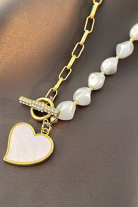 Gold Heart Rhinestone Pearl Necklace with heart pendant, rhinestones, and pearls on an adjustable gold chain.