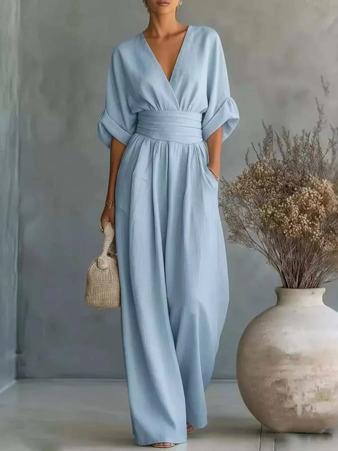 Woman wearing a Women's Full Size Half Sleeve Wide Leg Jumpsuit with relaxed fit and wide-leg design