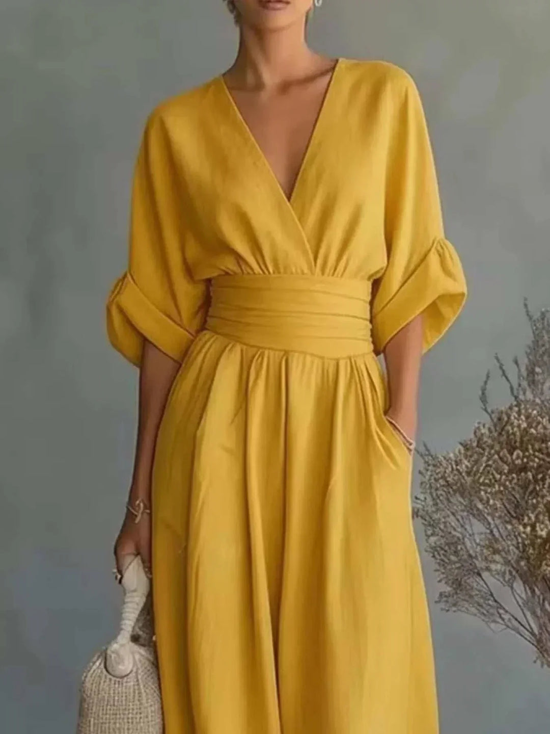 Woman wearing full size half sleeve wide leg jumpsuit in relaxed fit and breathable fabric