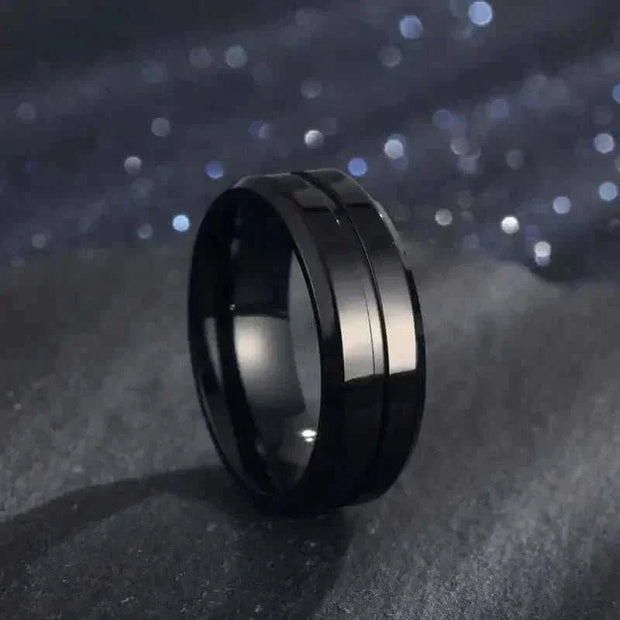 Gold Electroplated Ring with geometric design on dark background.