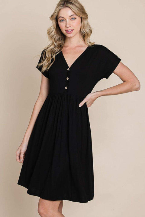 Chic black V-neck dress with short sleeves and button details, perfect for casual or formal occasions.